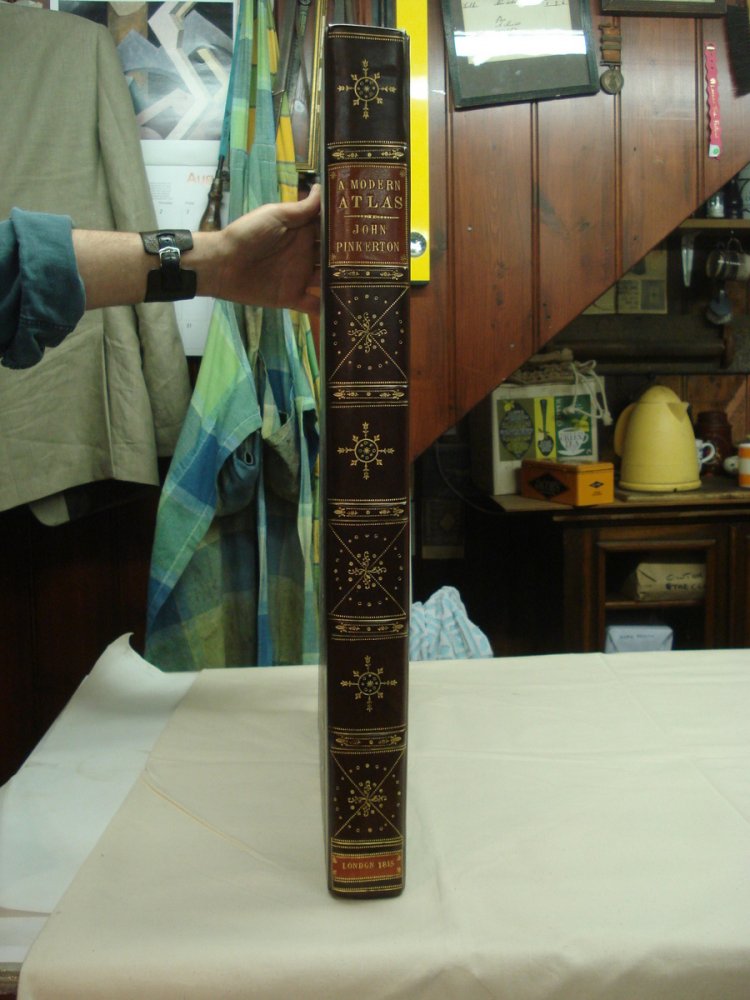 Large early 19thC Atlas bound in half calf with a Morroco label and onlays.